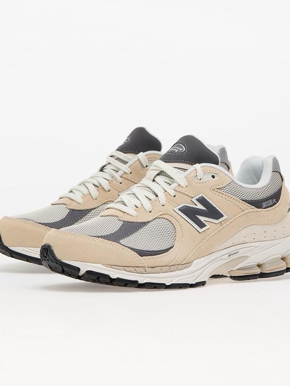 New Balance women’s size 8 men’s  6.5 Beige and Gray 2002R Retro Runner Sneakers